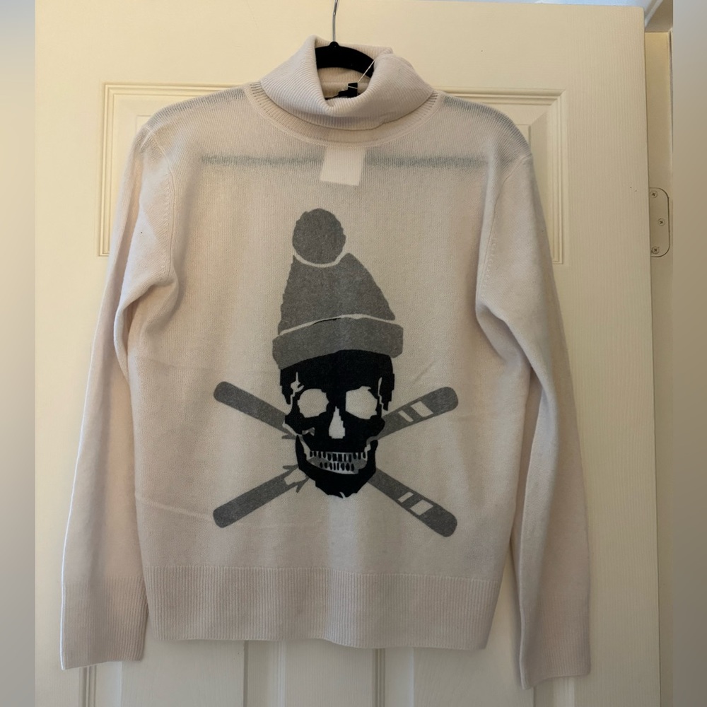 white sweater with a skull image! Size small!